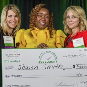 Jowan Smith holding check for top prize at Accelerate 2020
